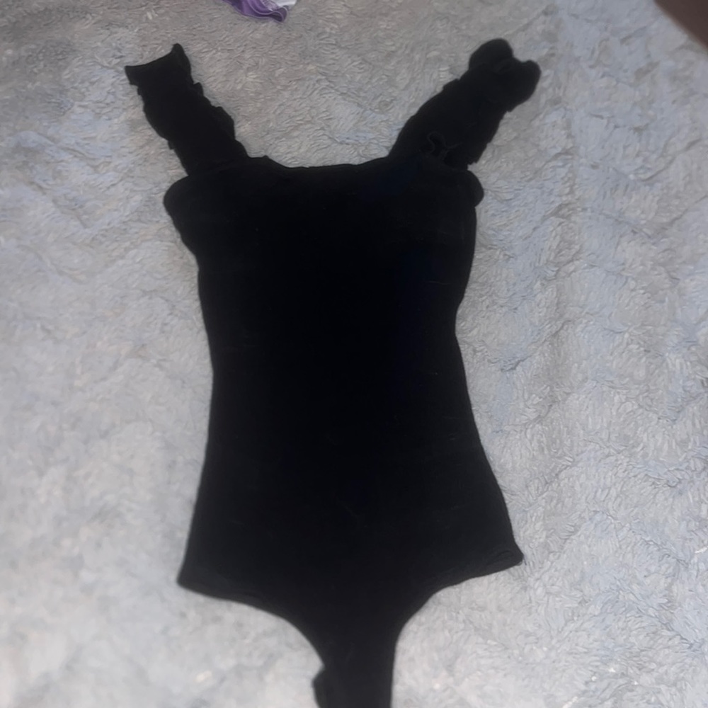 Jolie sleeveless black ruffle trim bodysuit